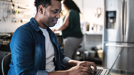 Man using laptop at home